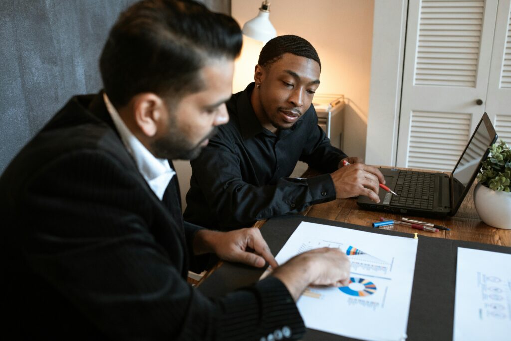 Man in black long sleeve shirt using black laptop computer