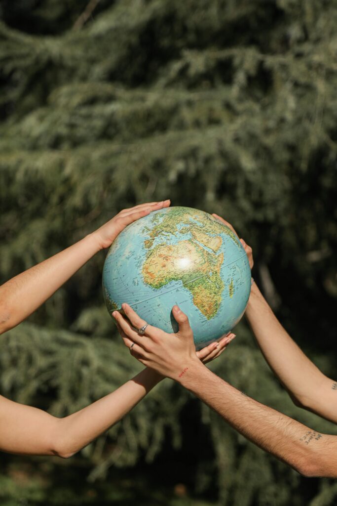 People holding a globe